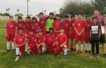  boys soccer team picture in red jerseys