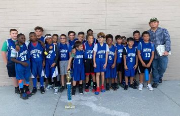  students in blue basketball jerseys