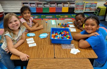  smiling students in a classroom