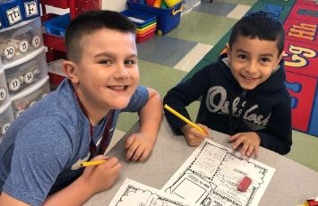  Two students work together at a table