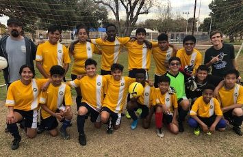  students in yellow soccer jerseys