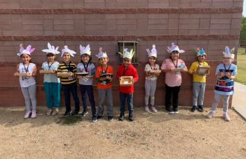  Students wear handmade hats