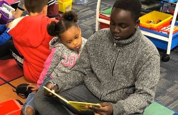  Two students read together