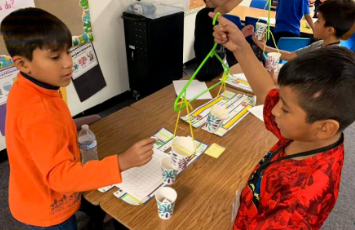  students work together on a science project