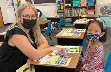  Student and teacher work together