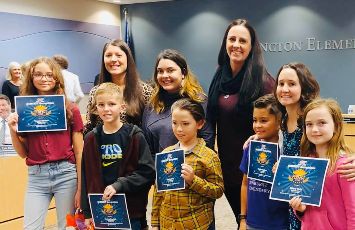  Jenn Dial and Sunburst Students holding certificates