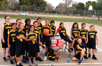  the girls basketball team takes a team picture