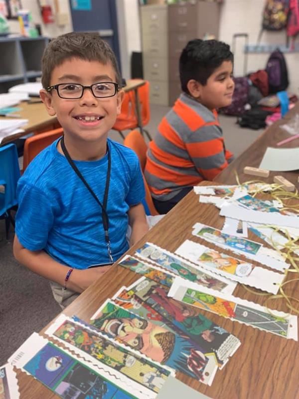 student completing an art project