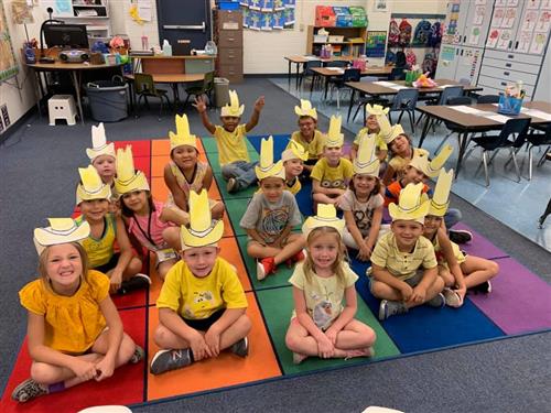 kindergarten students in yellow hats