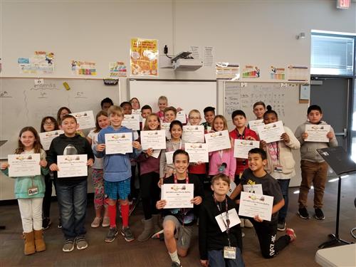 students holding certificates
