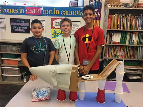 students with a science fair project
