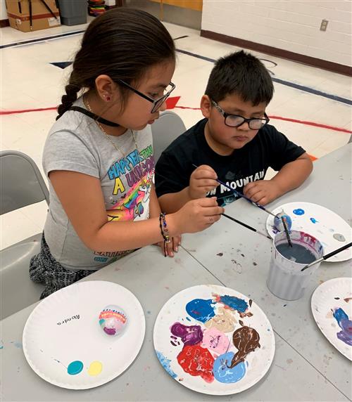 students paint