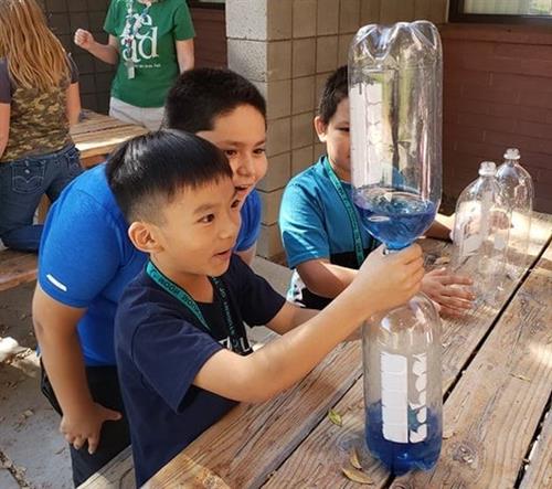students doing a science experiment
