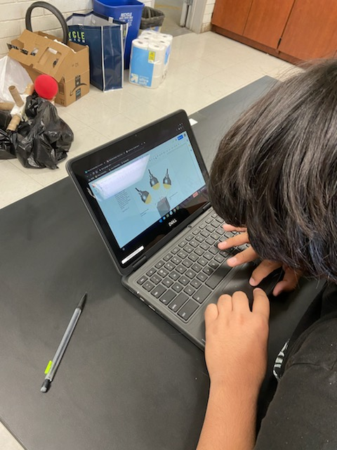 student works on a laptop