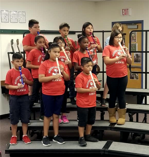students play recorders