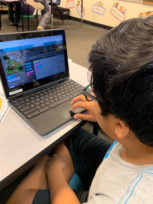 A student works on a laptop