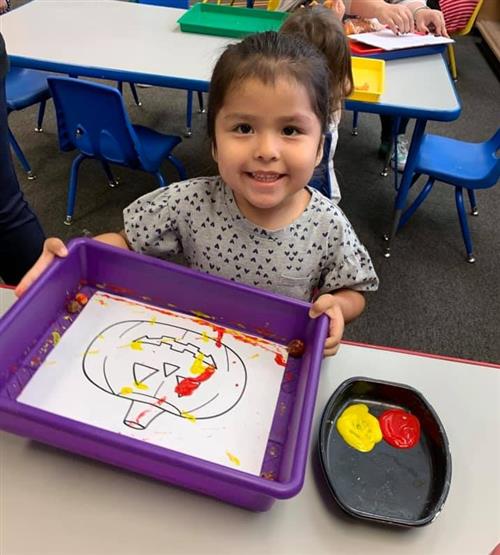 A student works on a painting project