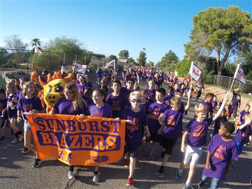 sunburst students walk in a parade