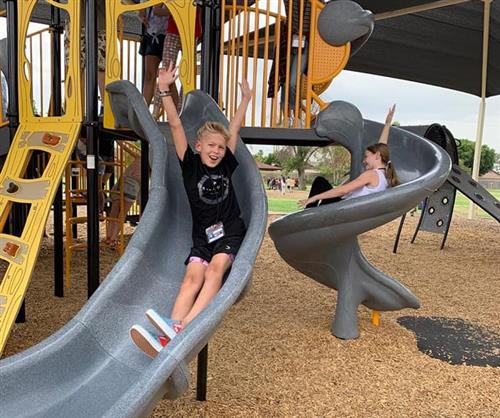 a student plays on the playground